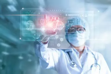 Doctor, surgeon analyzing patient brain testing result and human anatomy on technological digital futuristic virtual computer interface, digital holographic, innovative in science and medicine concept